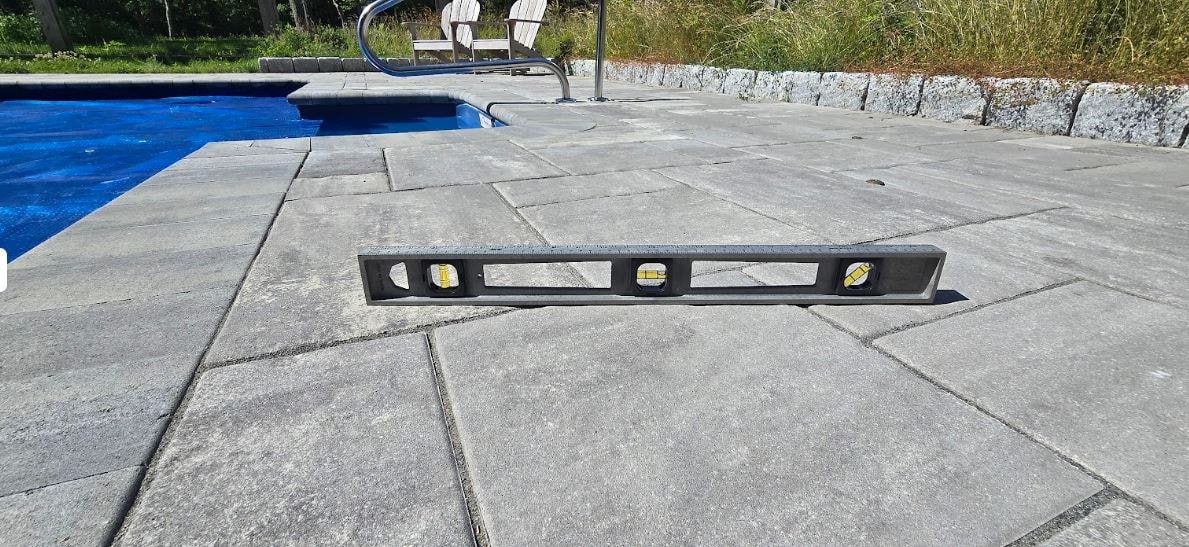 Shown from another section of pool...again pavers pitched toward the pool