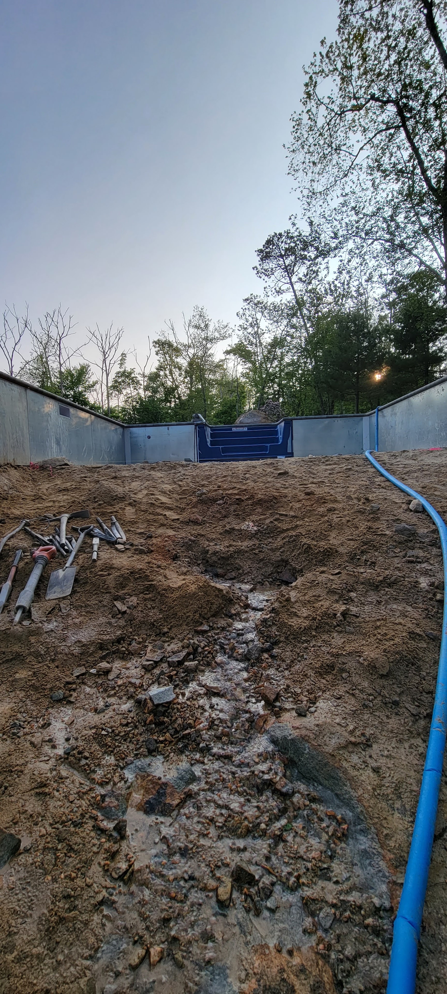 AMD jackhammering fractured ledge that exposed a natural spring.  AMD's response, was no problem!